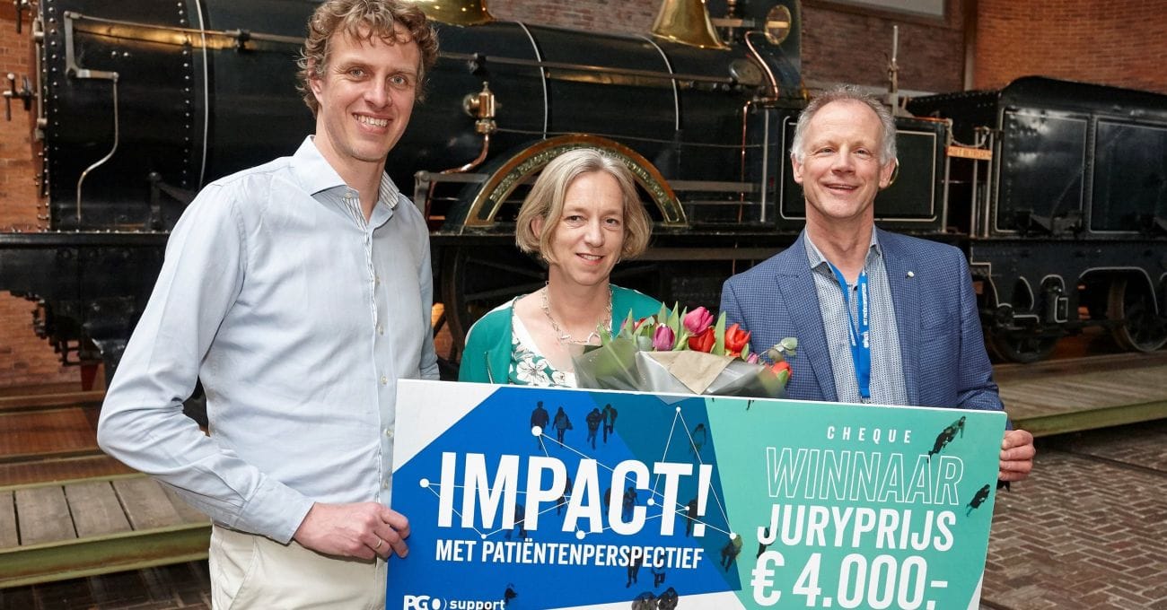 foto waarop medewerkers Oogvereniging de impactprijs 2018 in ontvangst nemen